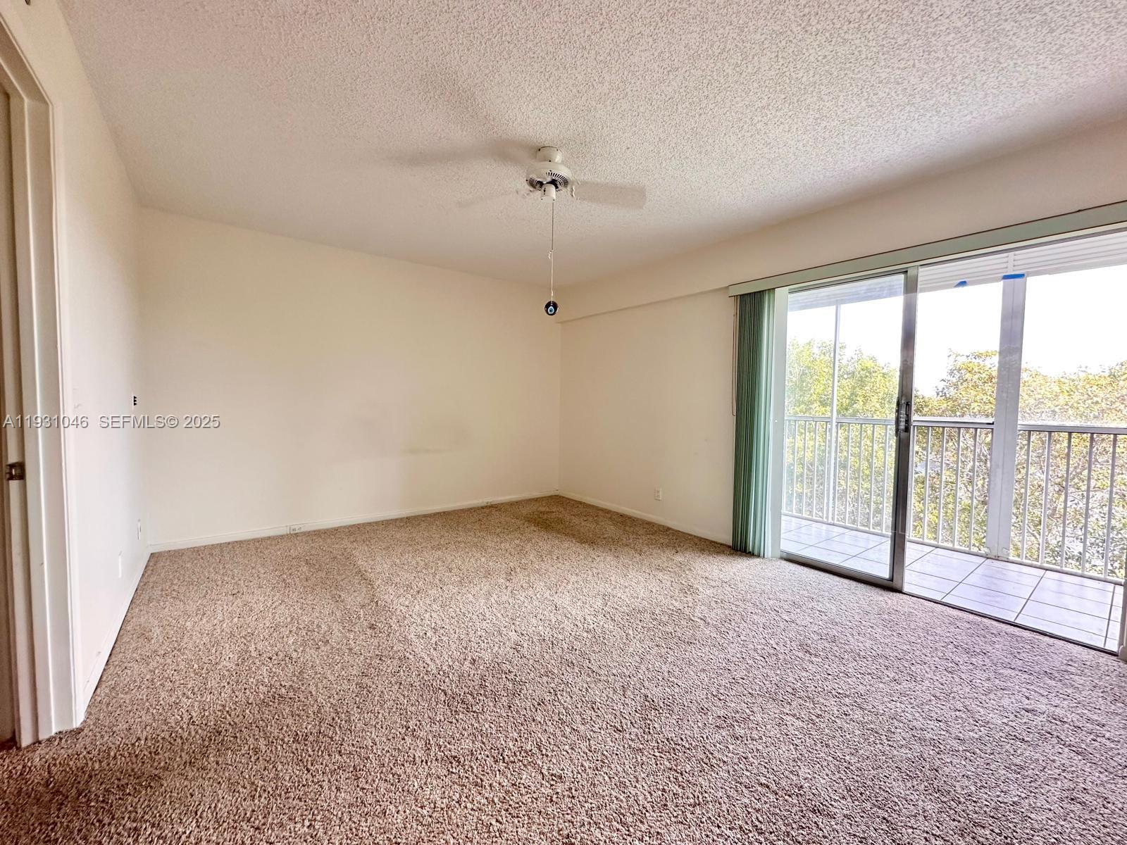 301 Southwest 135th Avenue, Unit 415C Pembroke Pines, FL 33027 - Photo 10 of 13 wooden floor in an empty room with a window
