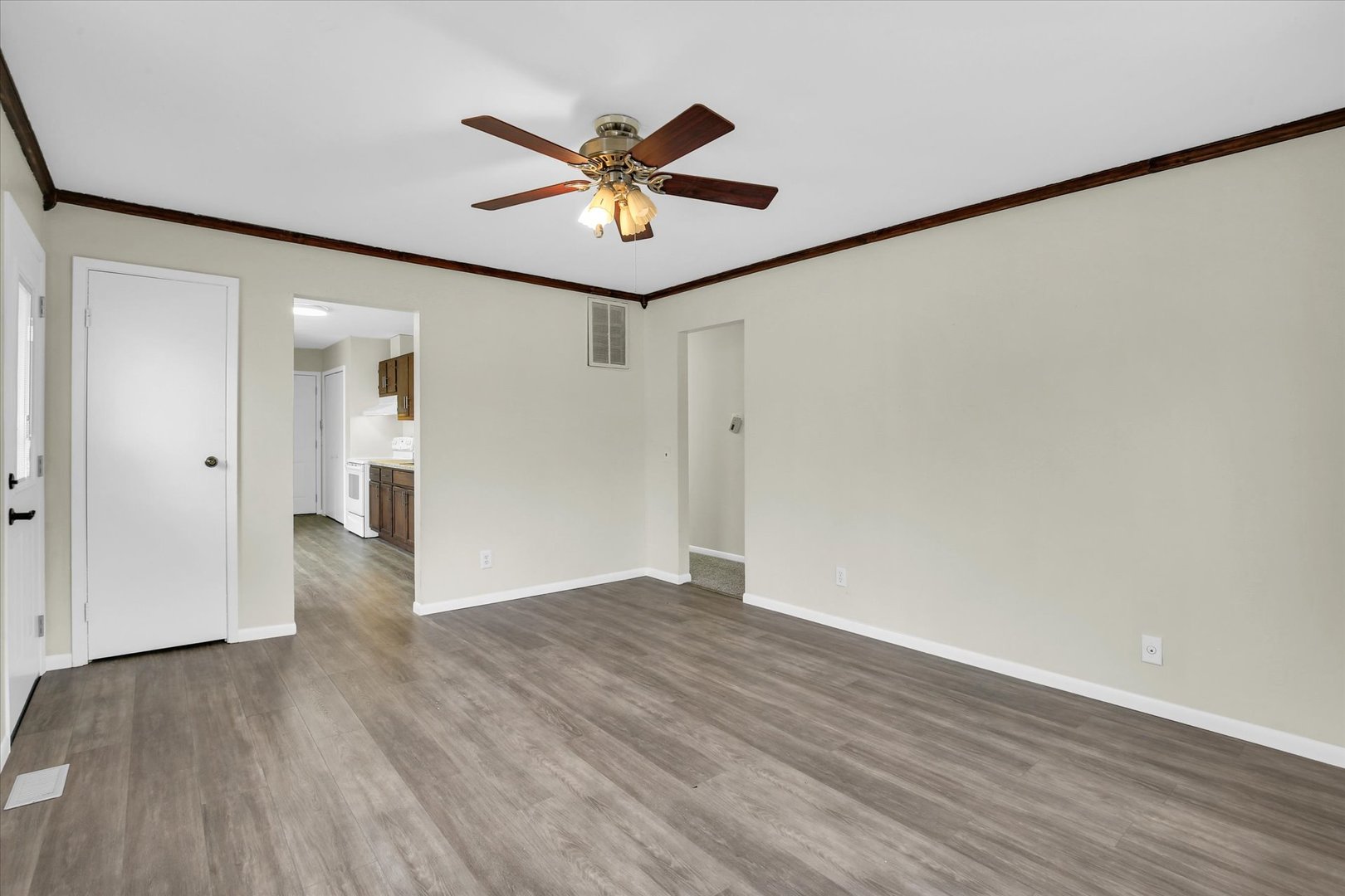 3206 York Drive Champaign, IL 61821 - Photo 2 of 24 a view of a big room with wooden floor and windows