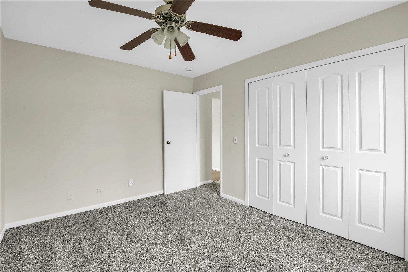 3206 York Drive Champaign, IL 61821 - Photo 4 of 24 an empty room with chandelier fan