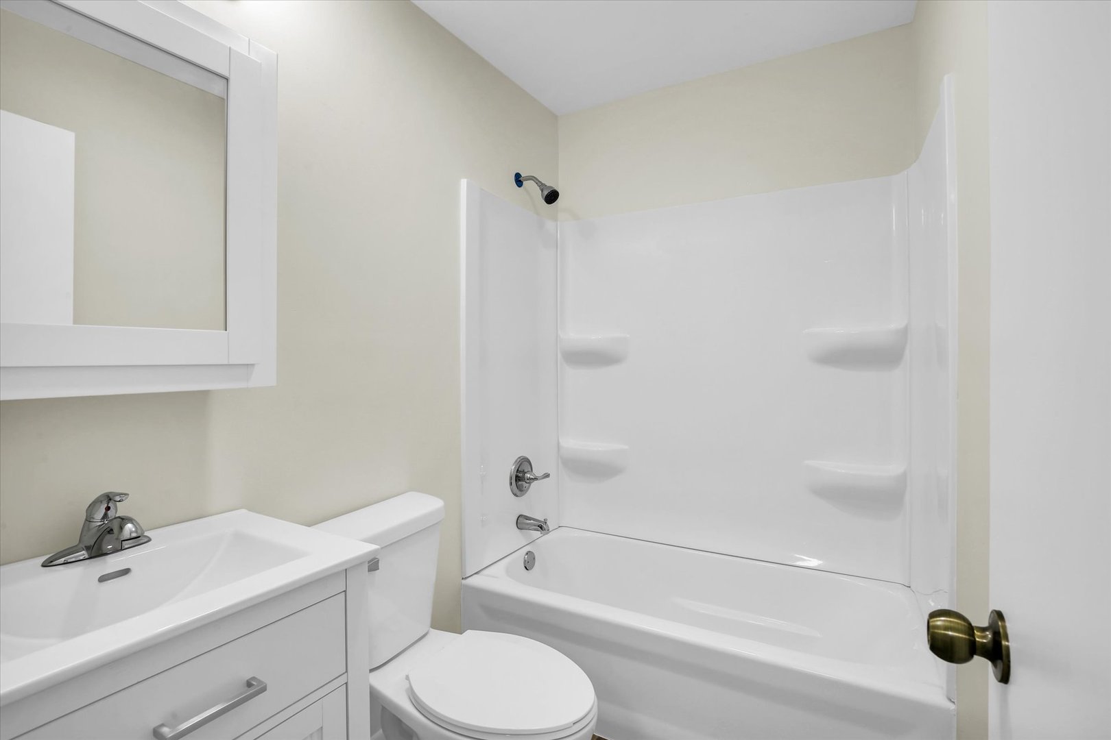 3206 York Drive Champaign, IL 61821 - Photo 5 of 24 a bathroom with a sink toilet and shower