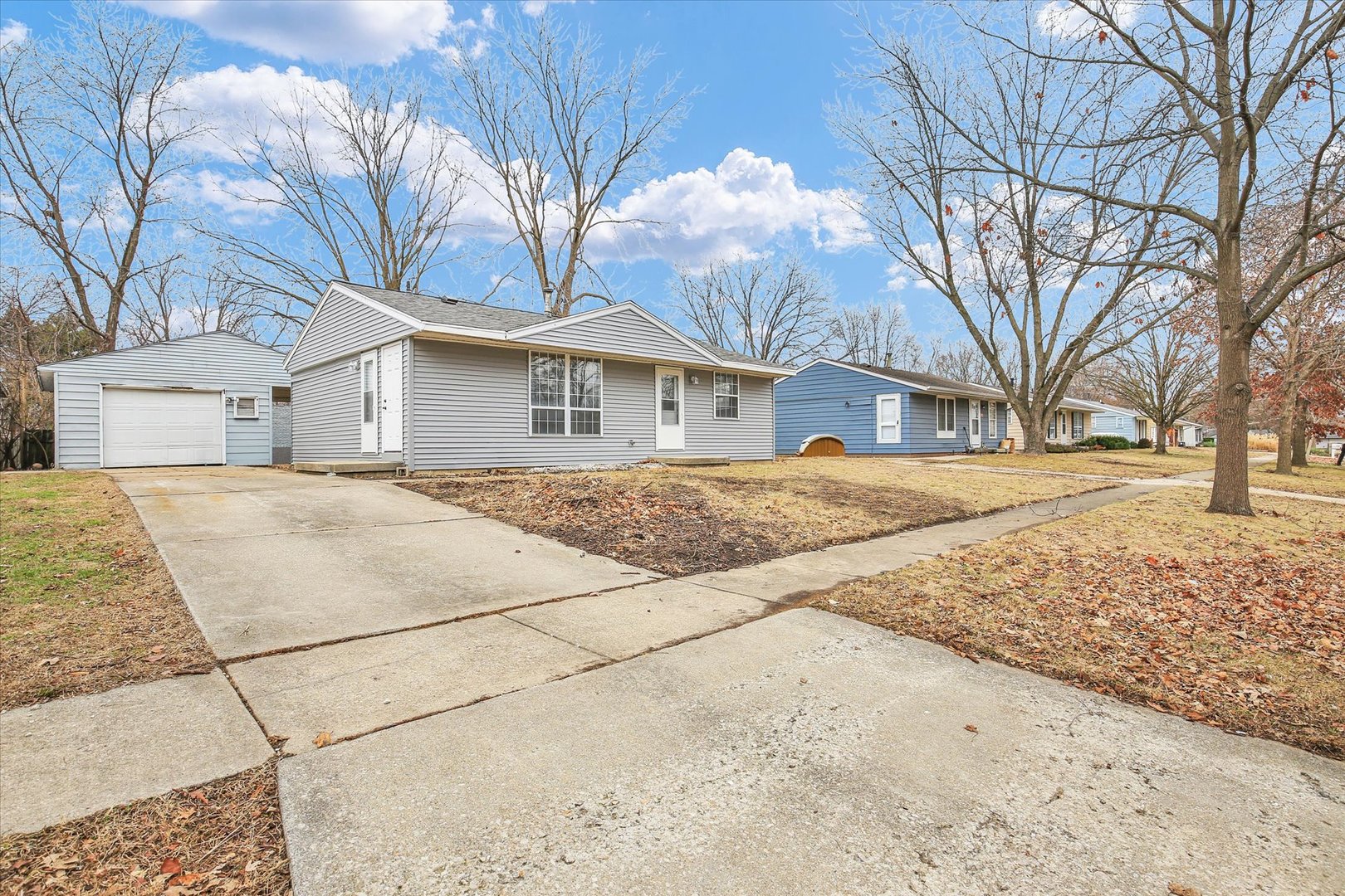 3206 York Drive Champaign, IL 61821 - Photo 8 of 24 a backyard of a house with large trees