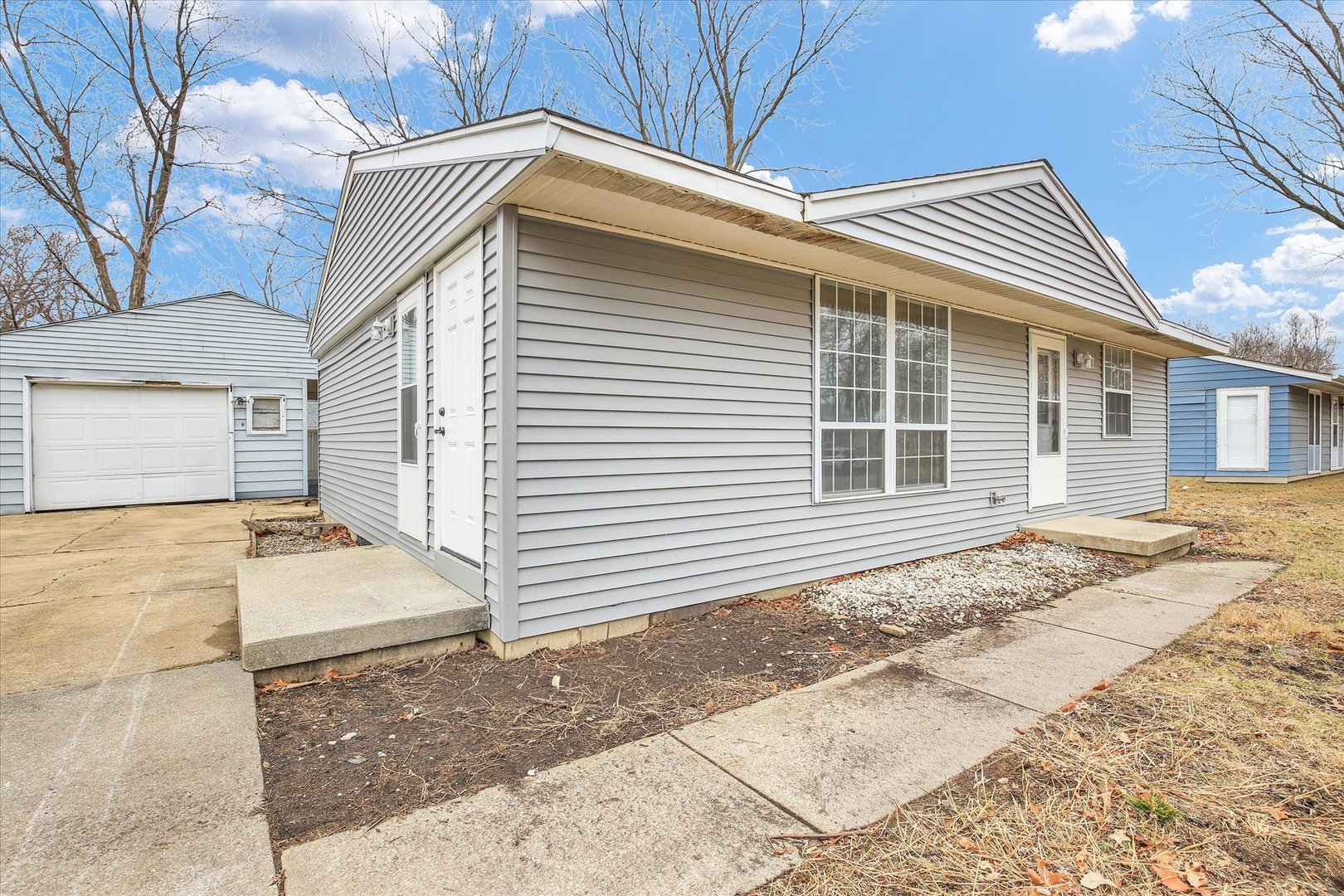 3206 York Drive Champaign, IL 61821 - Photo 10 of 24 a front view of a house with a garage