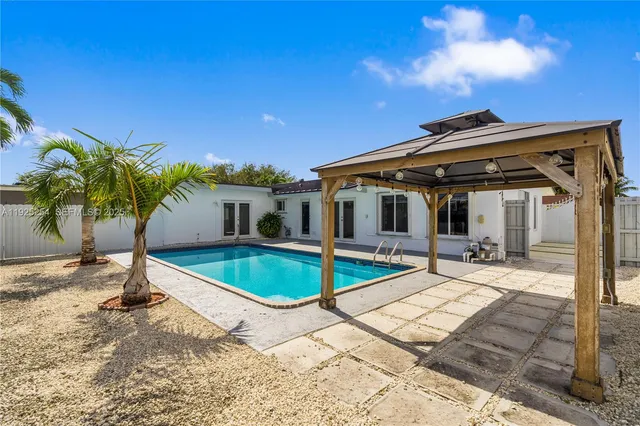 a front view of house with yard and entertaining space