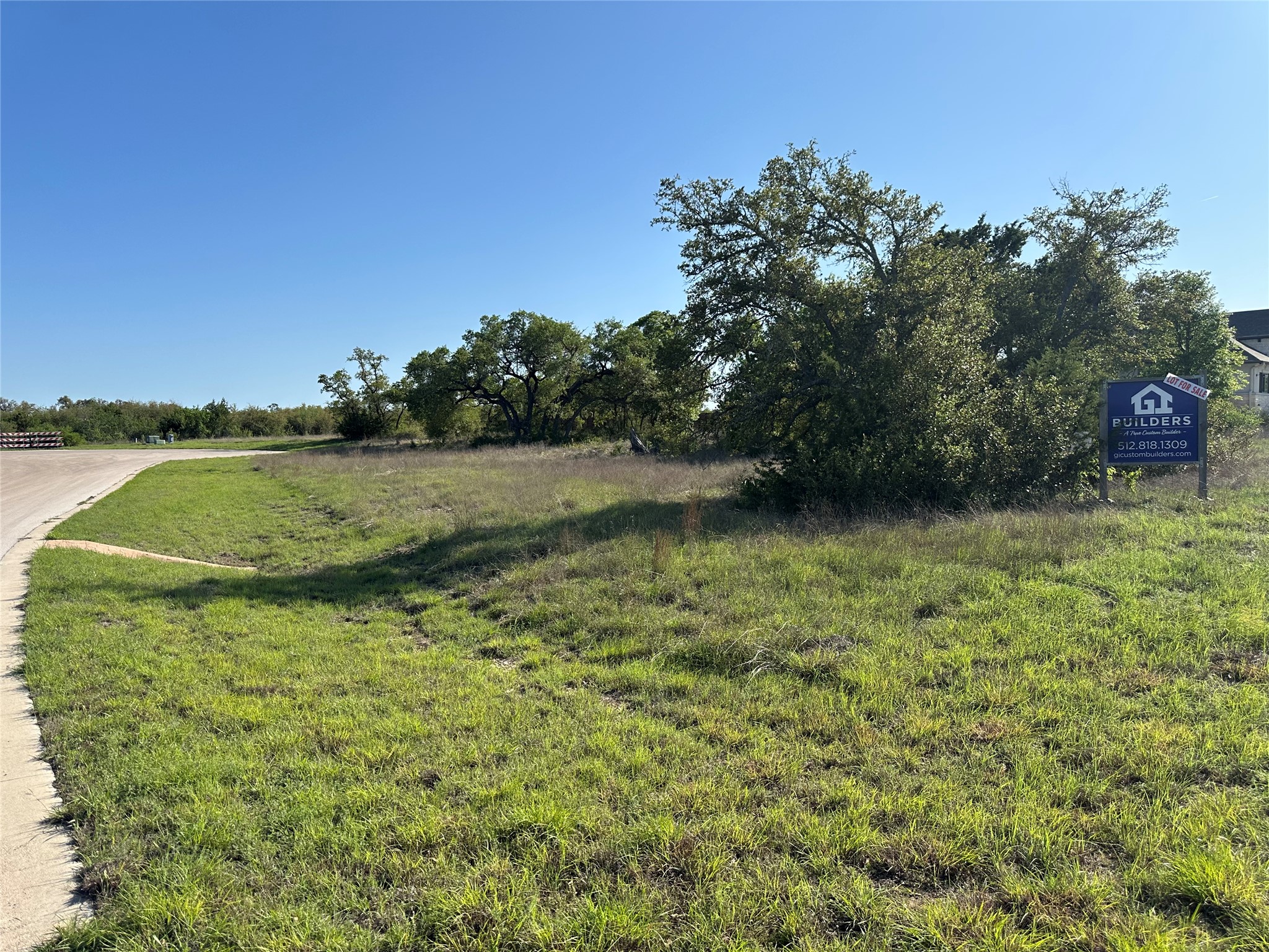 2204 Live Oak Road Leander, TX 78641 - Photo 4 of 5 a view of a field with an trees