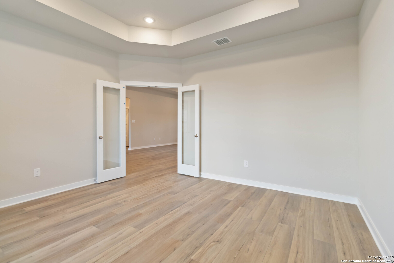 21225 Jordans Ranch Way San Antonio, TX 78264 - Photo 17 of 30 wooden floor in an empty room