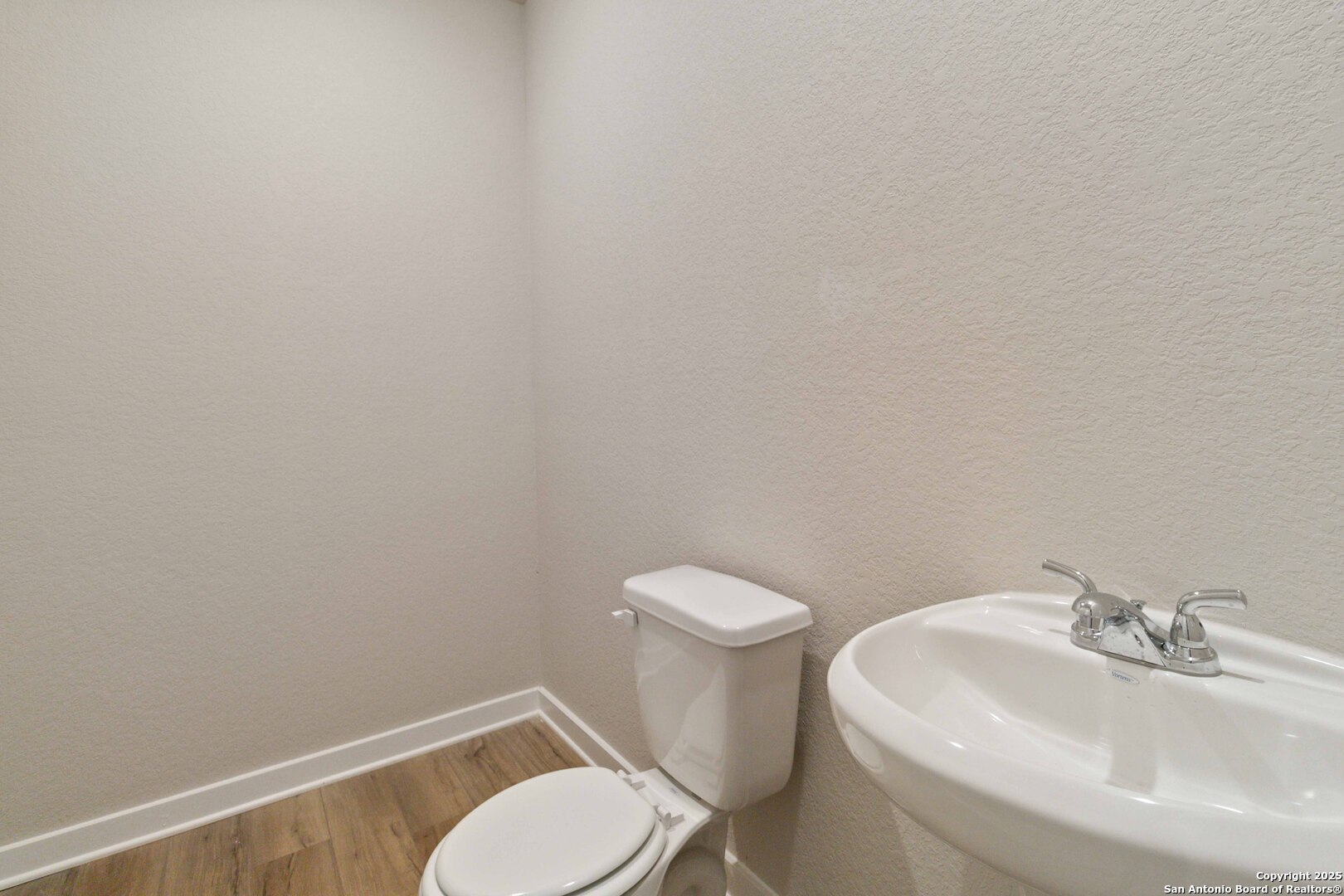 21225 Jordans Ranch Way San Antonio, TX 78264 - Photo 25 of 30 a white toilet sitting next to a white sink