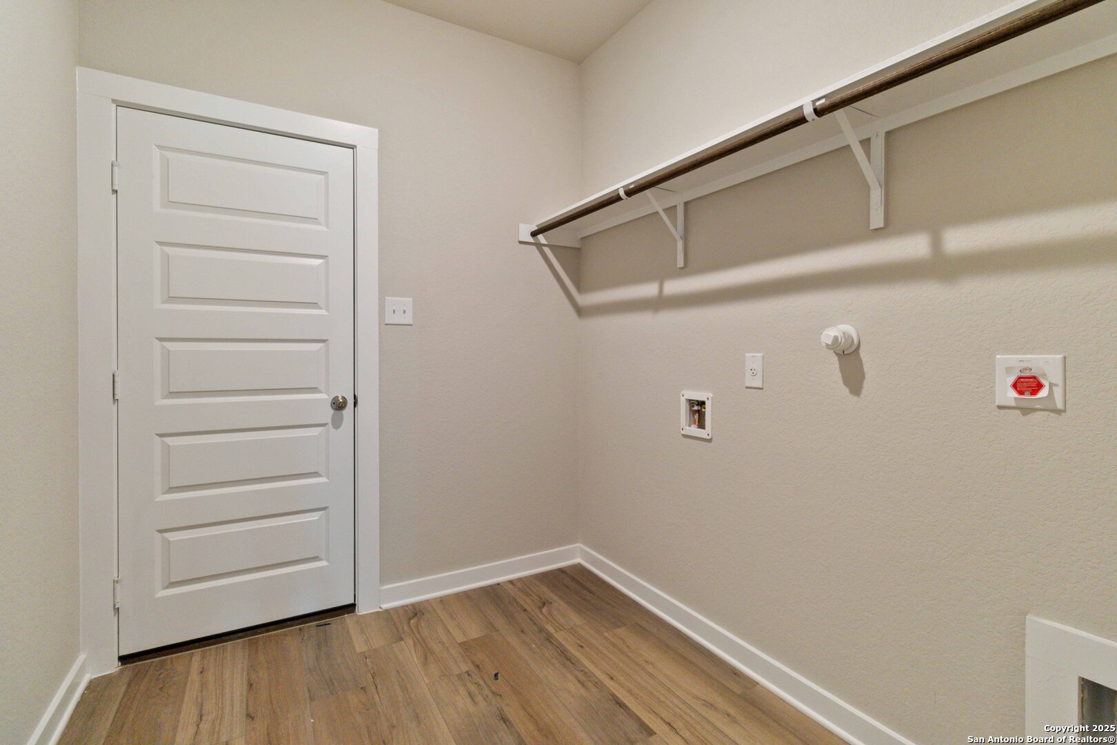21225 Jordans Ranch Way San Antonio, TX 78264 - Photo 27 of 30 a view of walk in closet with empty racks