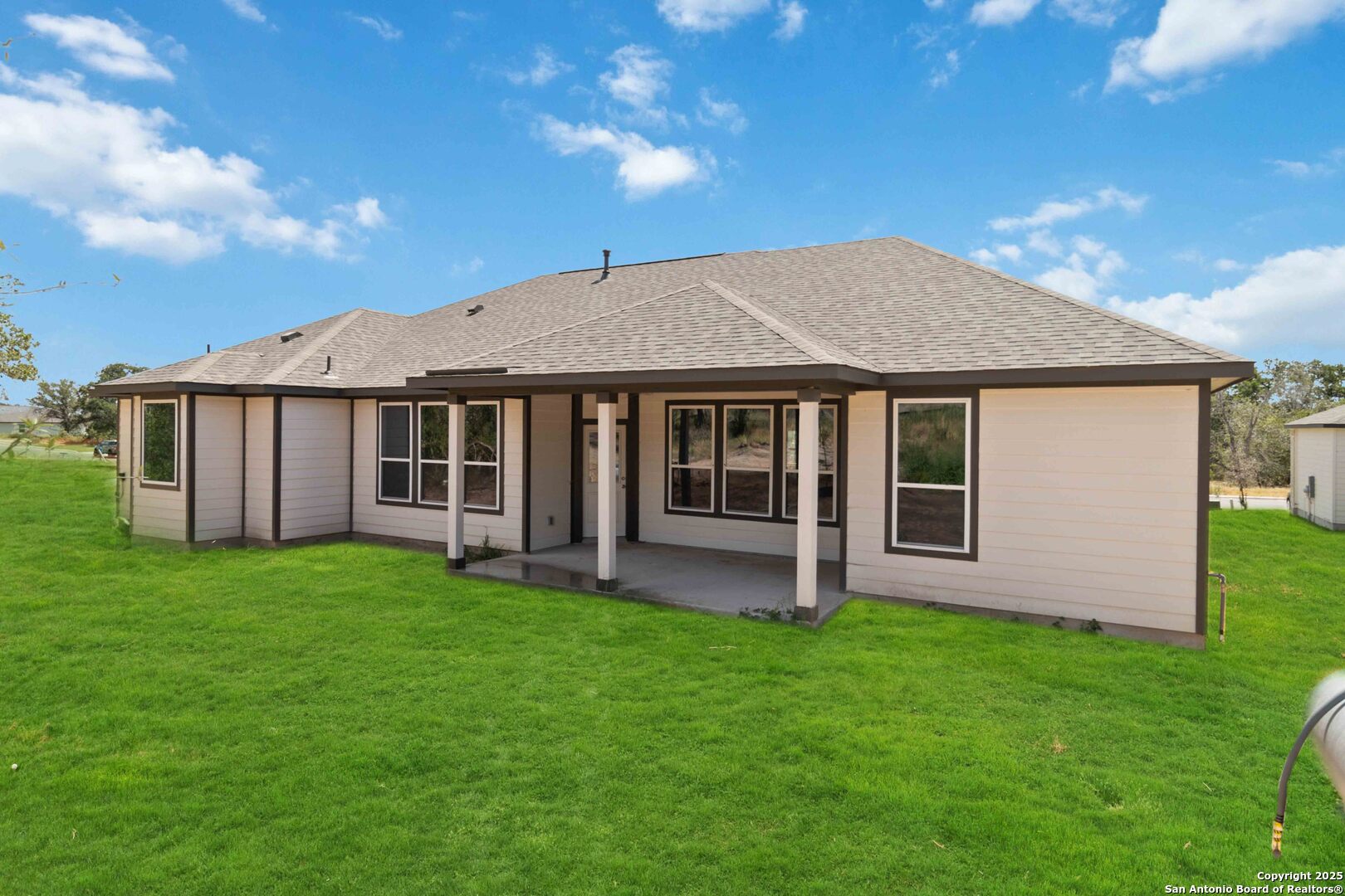 21225 Jordans Ranch Way San Antonio, TX 78264 - Photo 28 of 30 a house with garden in front of it