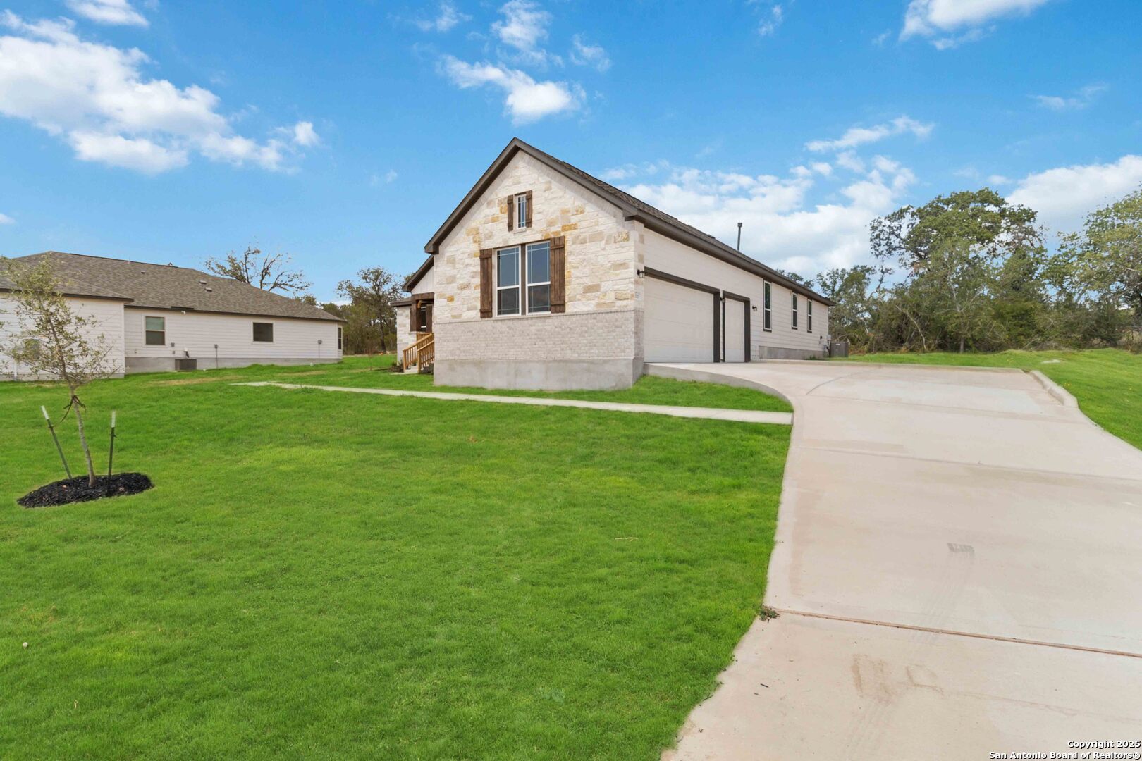 21225 Jordans Ranch Way San Antonio, TX 78264 - Photo 3 of 30 a view of a house with a yard