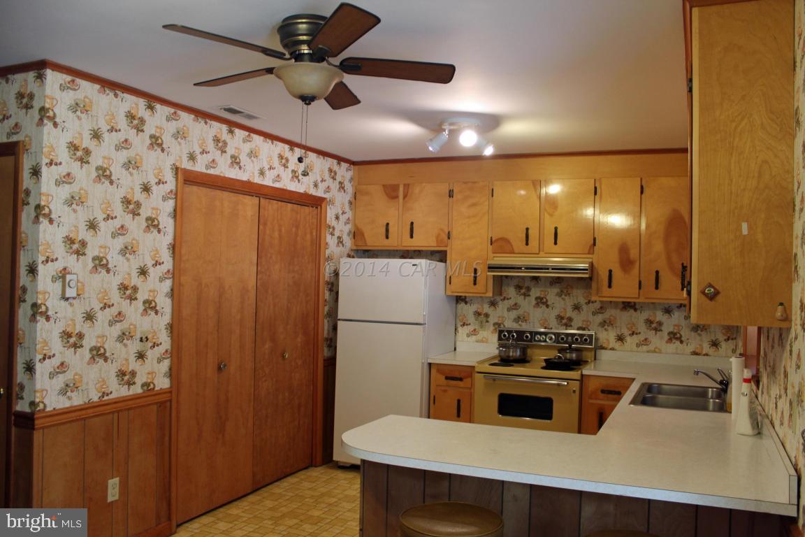20 Brookside Road Ocean Pines, MD 21811 - Photo 7 of 20 a kitchen with stainless steel appliances a refrigerator and a stove