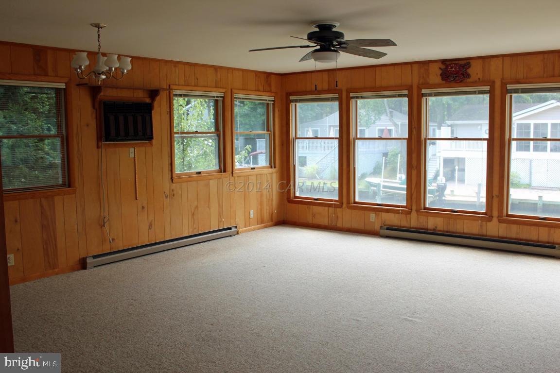 20 Brookside Road Ocean Pines, MD 21811 - Photo 9 of 20 a view of an empty room with a window and a kitchen