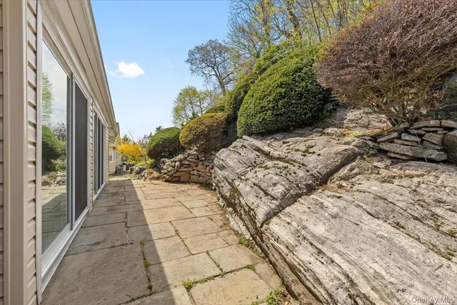 a view of a pathway both side of the house
