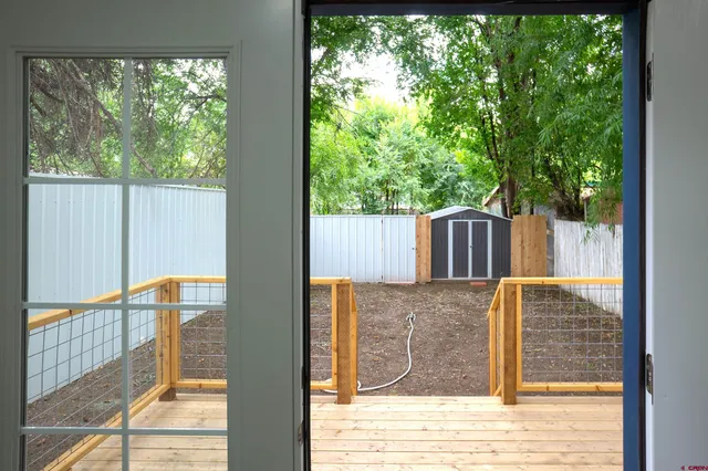 a view of outdoor space with wooden fence