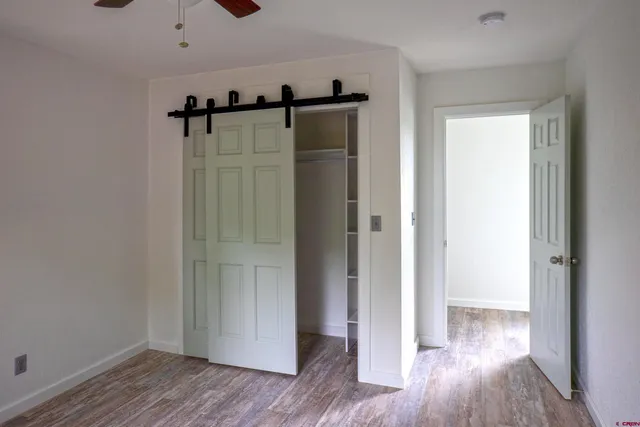 a view of an empty room with a window