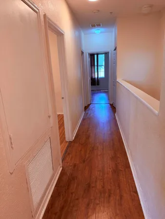 a view of gallery with wooden floor