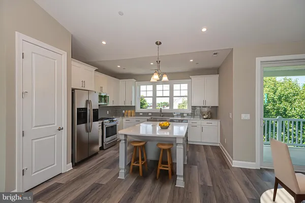 a kitchen with a sink and large window