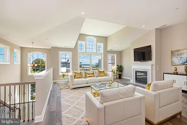 a living room with fireplace furniture and a flat screen tv