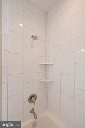 an aerial view of a house with a garden and lake view