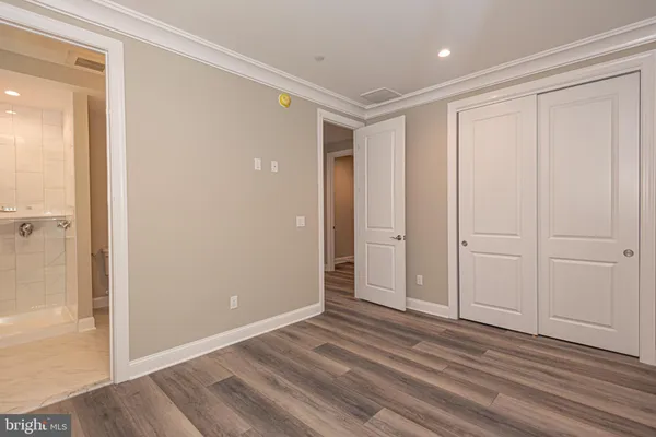 an aerial view of residential houses with outdoor space and swimming pool