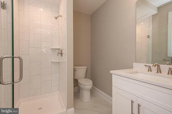 an aerial view of a house with a yard and lake view