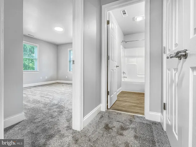 a bathroom with a sink toilet and bathtub