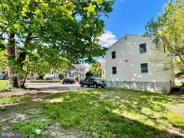 a view of backyard with a garden and entertaining space