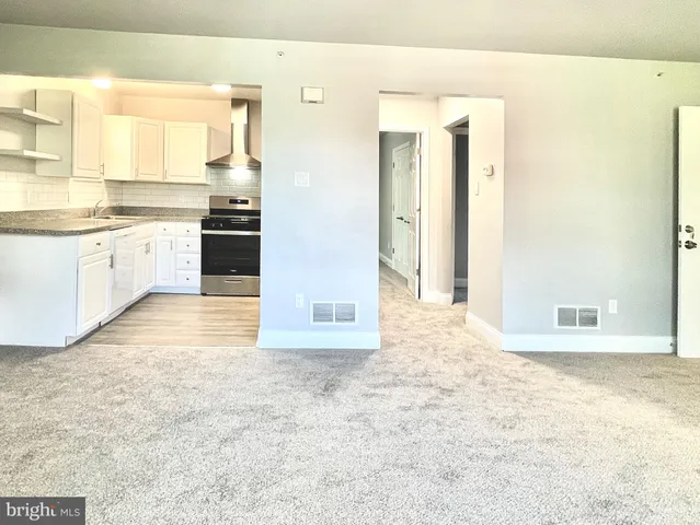 a view of a kitchen with a sink