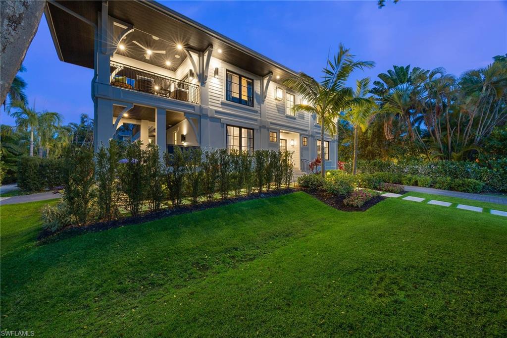 1355 4th Street South Naples, FL 34102 - Photo 12 of 50 a view of a building with a yard