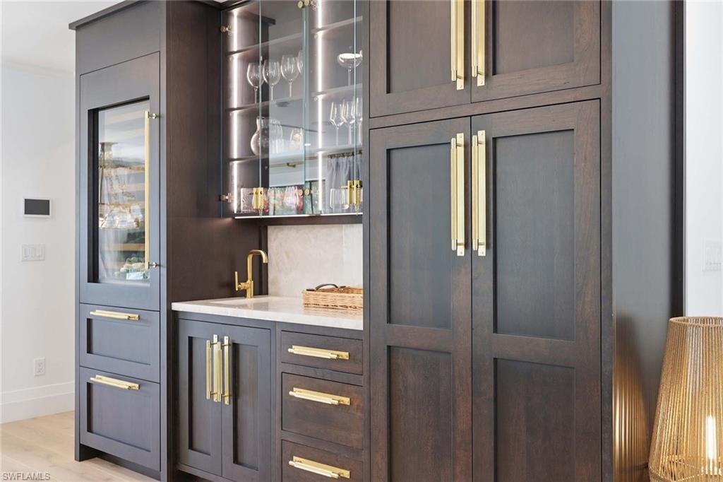 1355 4th Street South Naples, FL 34102 - Photo 18 of 50 a kitchen with a cabinets and appliances