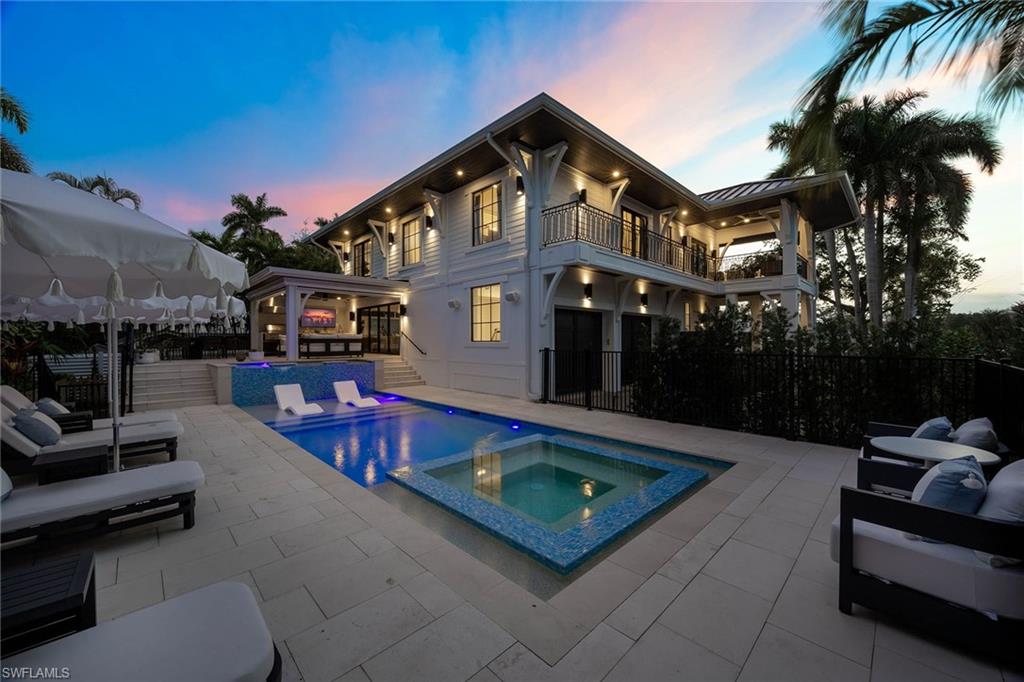 1355 4th Street South Naples, FL 34102 - Photo 3 of 50 a view of a chairs and tables in the patio