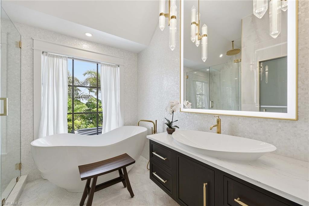1355 4th Street South Naples, FL 34102 - Photo 33 of 50 a bathroom with a sink and a mirror