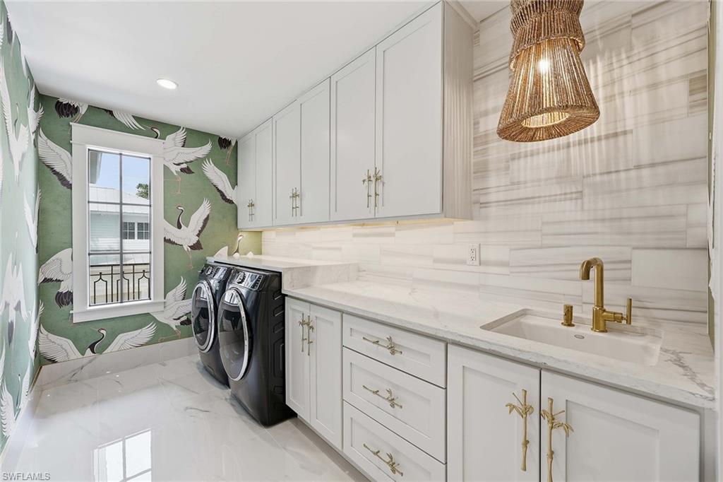 1355 4th Street South Naples, FL 34102 - Photo 41 of 50 a kitchen with a sink and cabinets