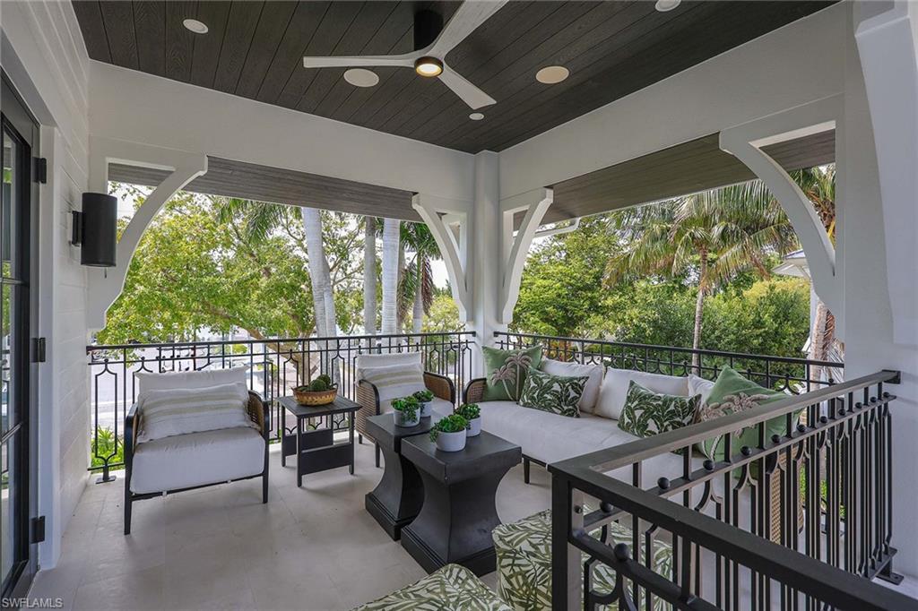 1355 4th Street South Naples, FL 34102 - Photo 42 of 50 a view of a patio with couches chairs and potted plants