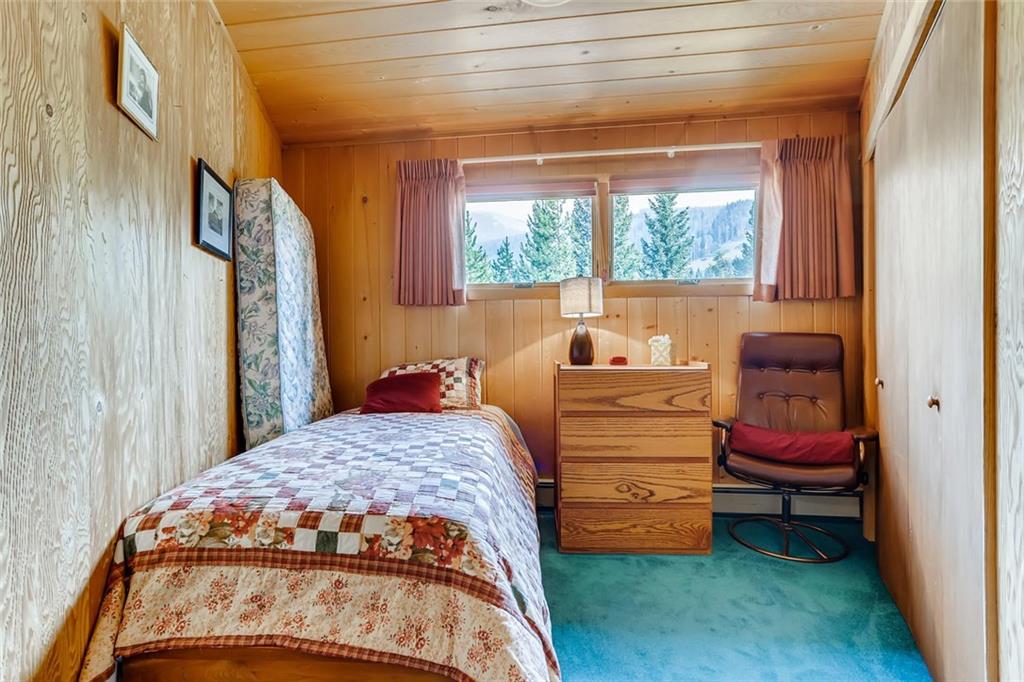 96 River Run Road Keystone, CO 80435 - Photo 14 of 28 a bedroom with a bed and a window