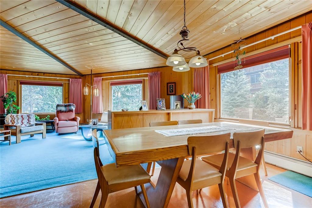 96 River Run Road Keystone, CO 80435 - Photo 8 of 28 a dining room with furniture a chandelier and wooden floor