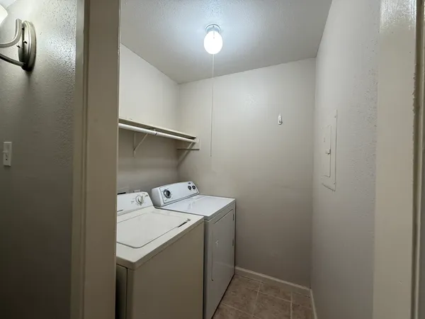 a view of house with backyard and swimming pool