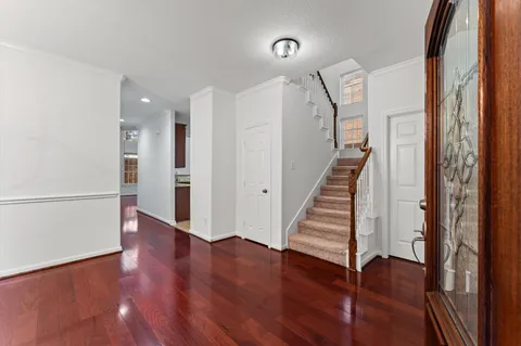 a view of entryway with wooden floor