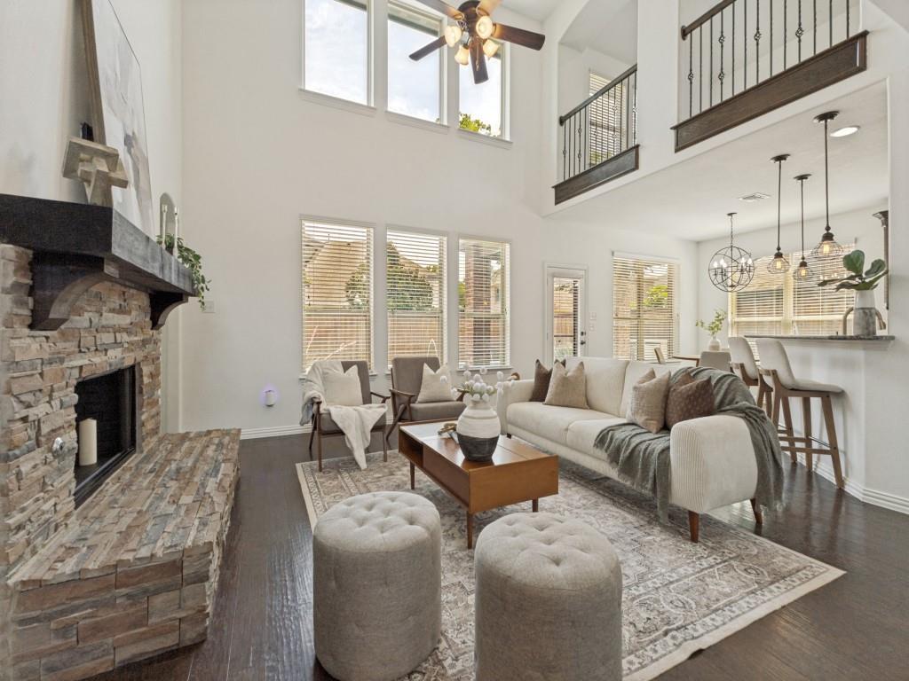 916 Redbird Lane Allen, TX 75013 - Photo 6 of 28 Large living room with a wall of windows overlooking the pool.