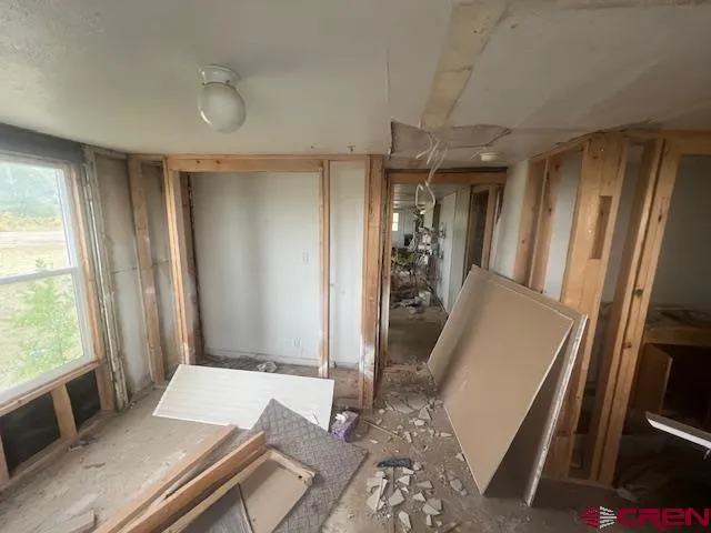 a bed room with a bed and a window