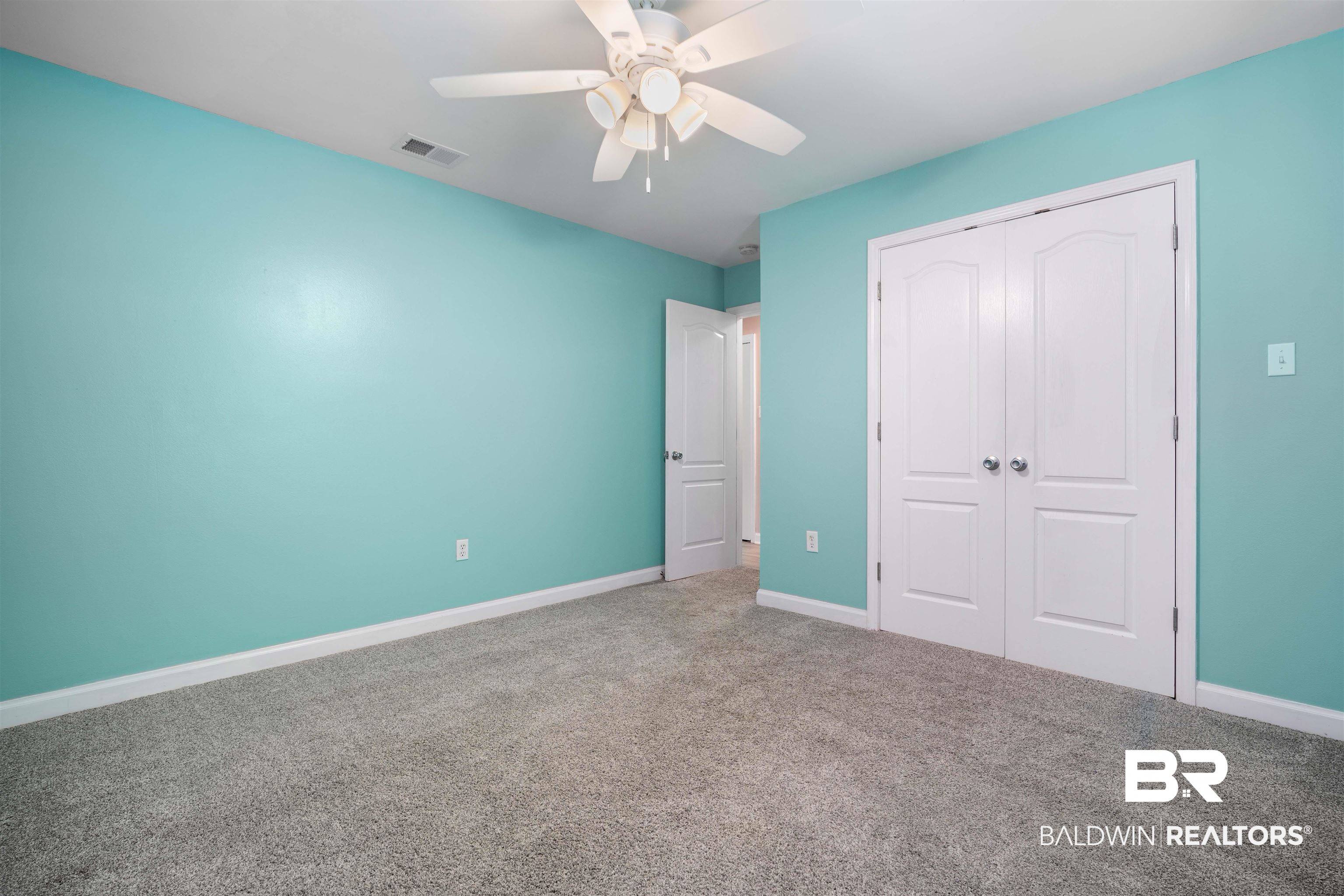3010 Drag Strip Lane Coden, AL 36523 - Photo 25 of 44 Unfurnished bedroom with a closet, carpet, and ceiling fan