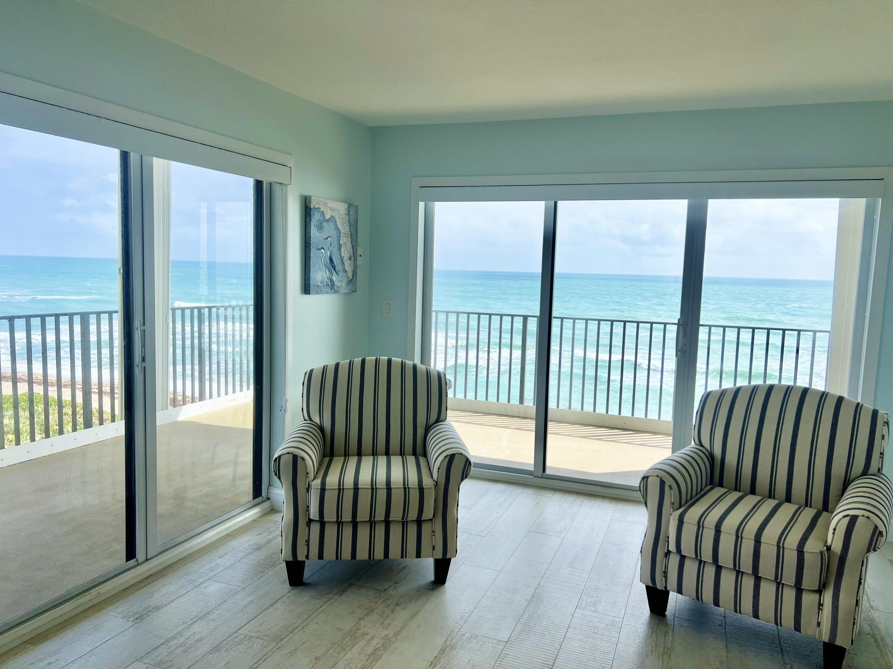 7410 South Ocean Drive, Unit 505 Jensen Beach, FL 34957 - Photo 5 of 33 a living room with furniture and a large window
