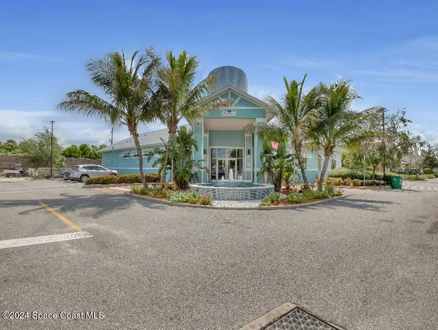 a view of a street with a car parked in front of it