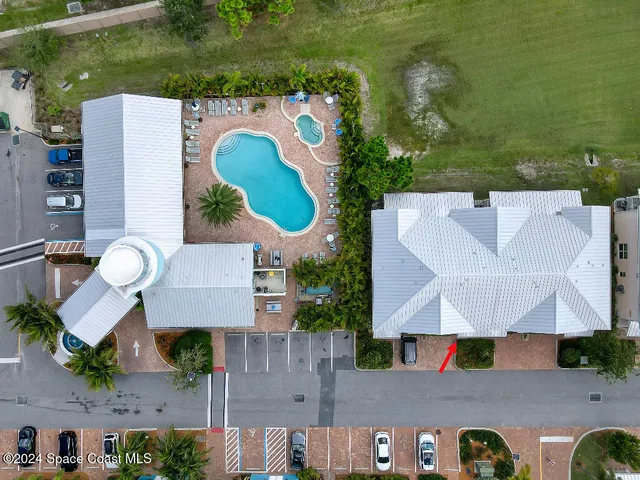an aerial view of house with yard swimming pool and outdoor seating