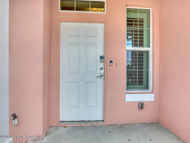 an entryway with wooden floor