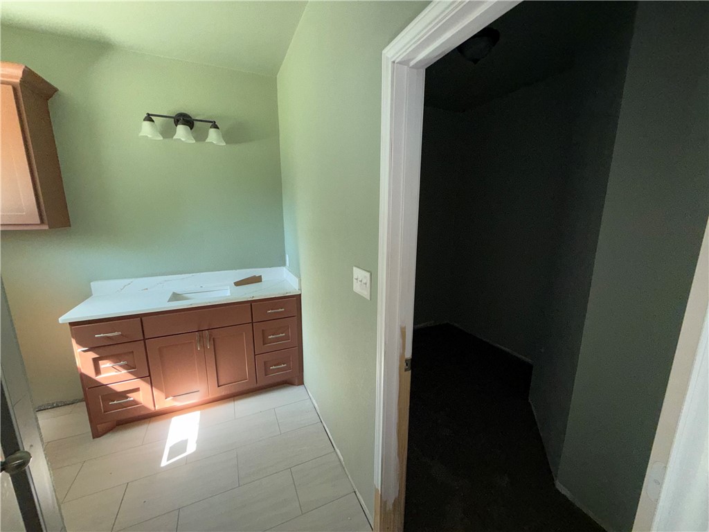 1614 Conlee Street Bryan, TX 77803 - Photo 16 of 20 a bathroom with a bathtub sink and mirror
