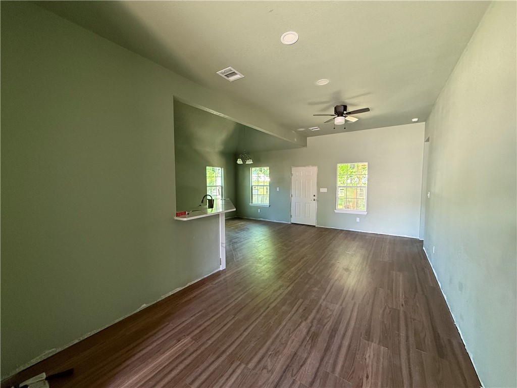 1614 Conlee Street Bryan, TX 77803 - Photo 2 of 20 wooden floor in an empty room with a window