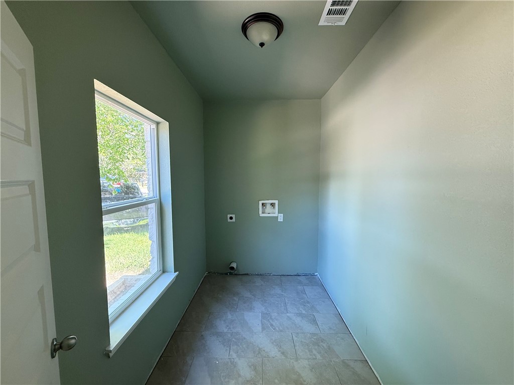 1614 Conlee Street Bryan, TX 77803 - Photo 3 of 20 a view of an empty room with a window