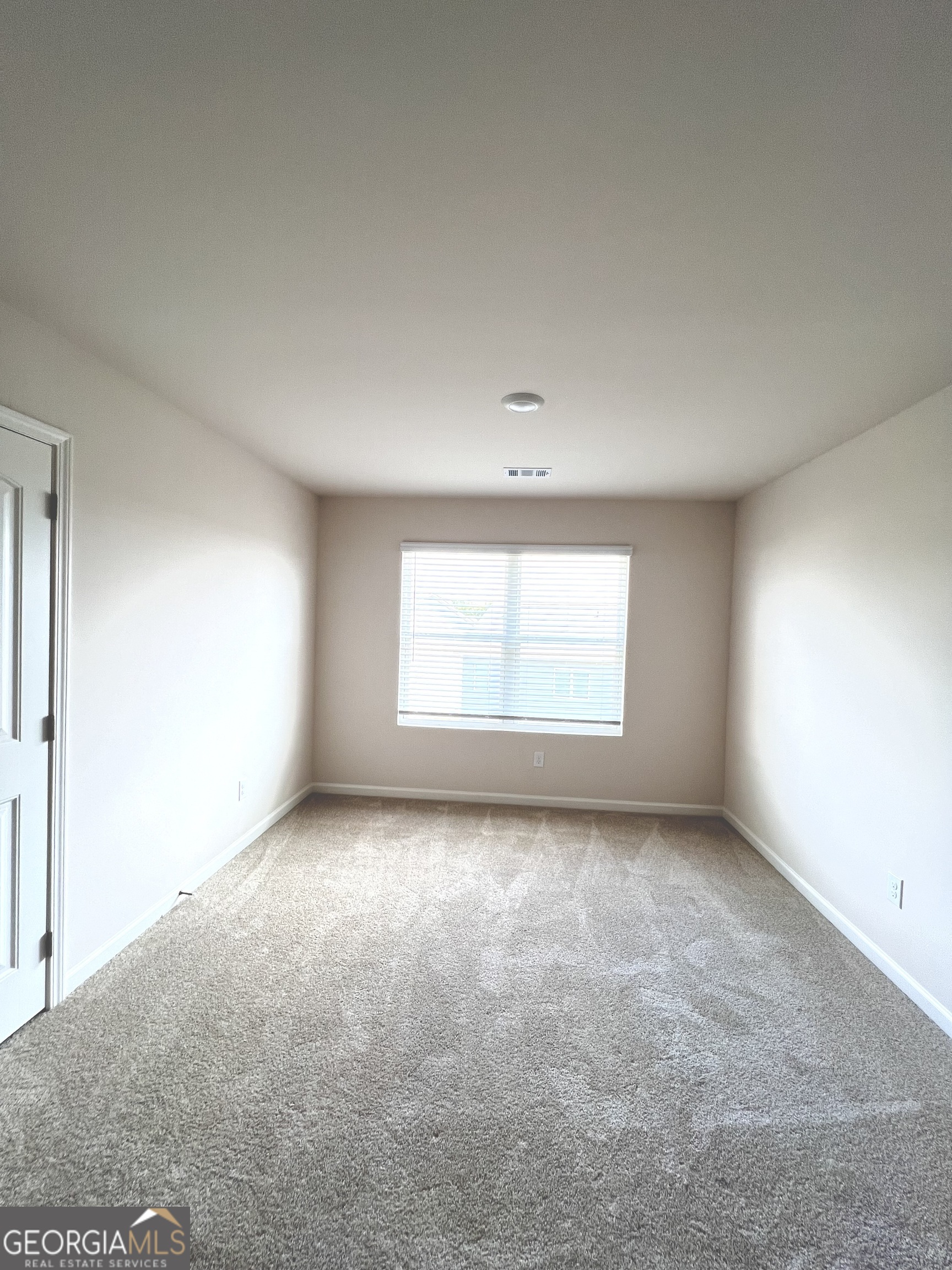 393 Walnut Grove Way Pendergrass, GA 30567 - Photo 15 of 22 an empty room with windows