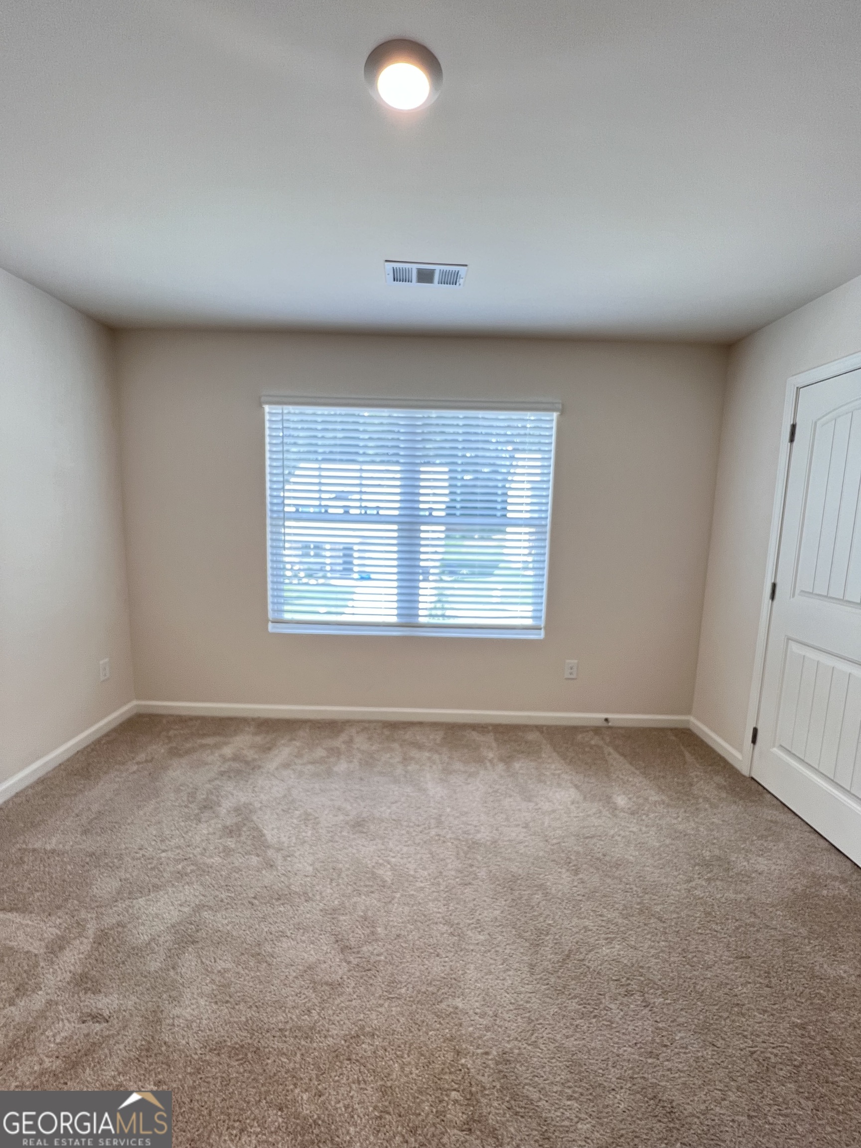 393 Walnut Grove Way Pendergrass, GA 30567 - Photo 18 of 22 an empty room with a empty space and windows