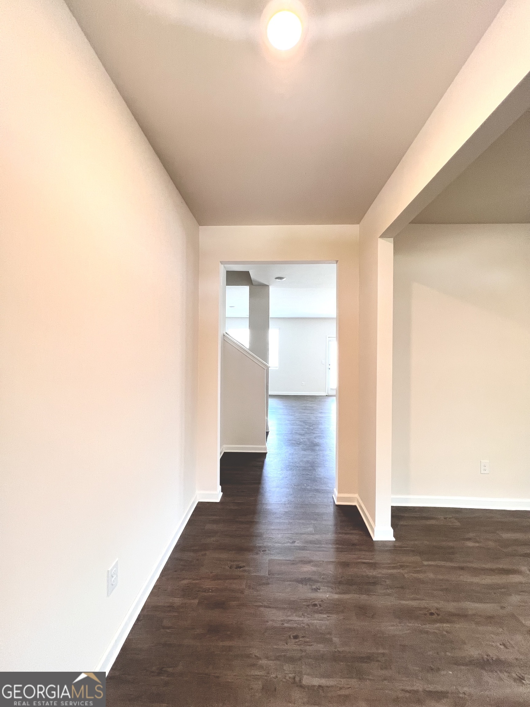 393 Walnut Grove Way Pendergrass, GA 30567 - Photo 4 of 22 a view of an empty room with wooden floor and a window
